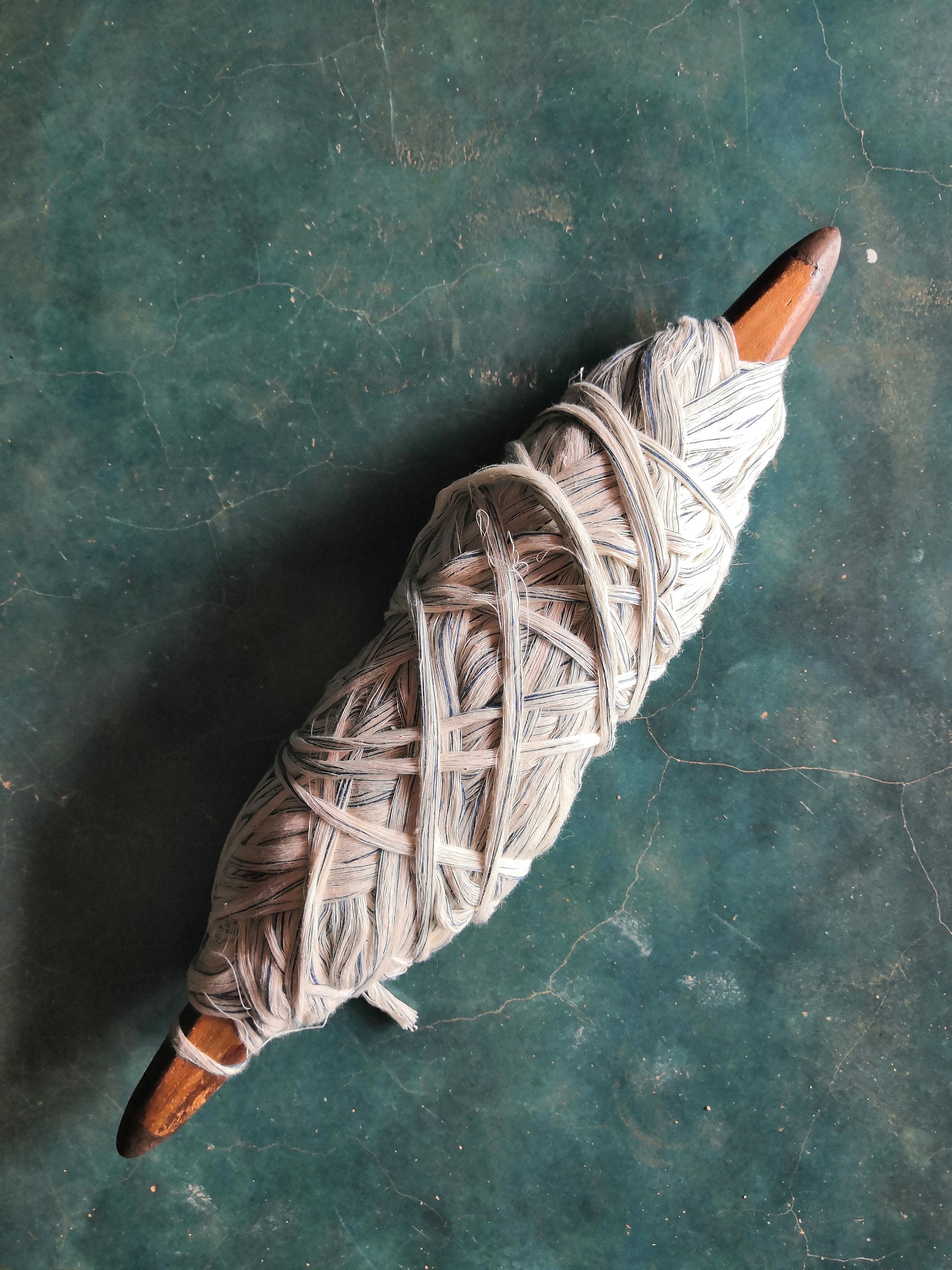 Thread wrapped around a weaving shuttle